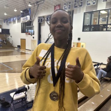 Elle Smith poses with her medals.